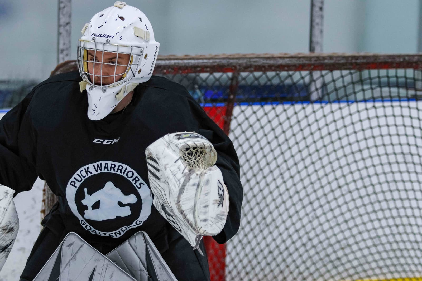 Goalie making a glove save during PWG training